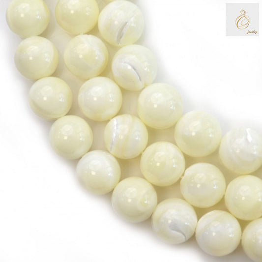 Close-up view of natural white shell mother-of-pearl beads with 1mm holes, 34 pieces per strand