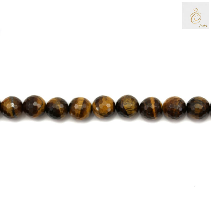 Close-up view of natural yellow tiger's eye beads displaying the lustrous golden-brown color and faceted surface detail