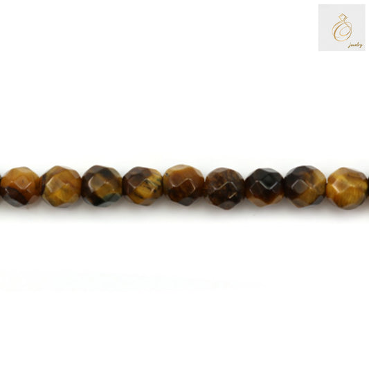 Close-up view of natural yellow tiger's eye beads displaying the distinctive golden striped patterns and faceted surface