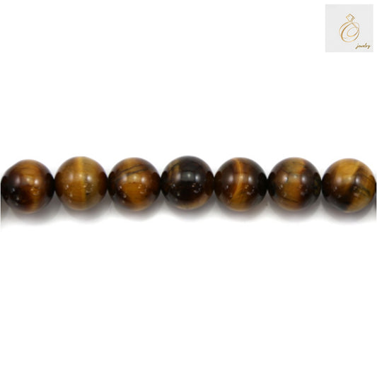 Close-up view of natural yellow tiger's eye beads showing golden striped pattern and smooth polished surface, 12mm round gemstone beads