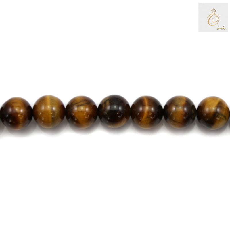 Close-up view of natural yellow tiger's eye round beads displaying characteristic golden striped patterns and smooth finish