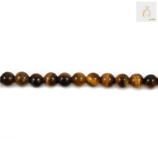 Close-up view of natural yellow tiger's eye round beads showing golden bands and smooth finish, 6mm diameter with 1.2mm holes