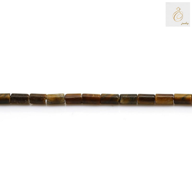 Close-up view of natural tiger's eye beads showing detailed golden-brown striped patterns and smooth cylinder shape