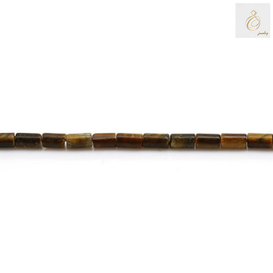 Close-up view of natural tiger's eye beads showing detailed golden-brown striped patterns and smooth cylinder shape