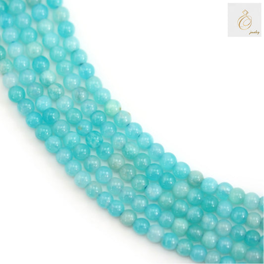 Peruvian Amazonite round beads 2mm blue-green gemstone strand for jewelry making"
"Natural Amazonite beads 39cm strand showing blue-green color variations"
"Close-up of 2mm round Peruvian Amazonite gemstone beads on white background