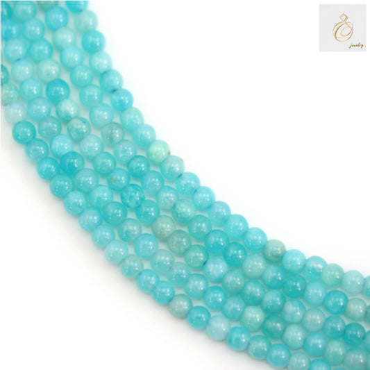 Natural Peruvian Amazonite round beads 3mm on white background showing blue-green color variations"
"Close-up of 3mm Amazonite gemstone beads displaying natural blue-green hues and smooth finish