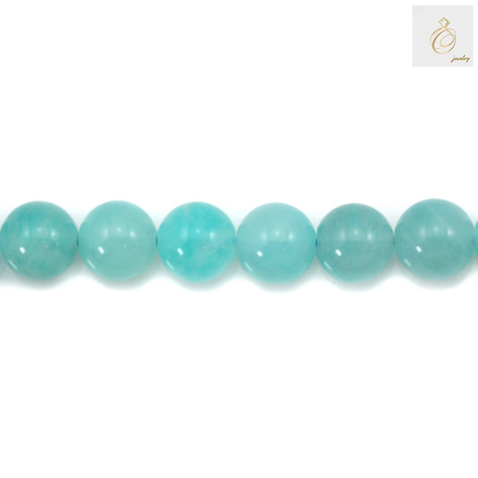 4mm Peruvian amazonite round beads showing natural blue-green color"
"Natural amazonite gemstone beads 4mm diameter for jewelry making"
"Close-up of smooth polished Peruvian amazonite round beads