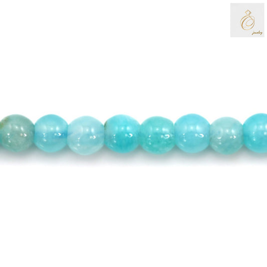 Amazonite bead strand showing 39cm length with consistent 3mm round bead size"
"Detail view of Peruvian Amazonite beads highlighting natural stone patterns and color variations