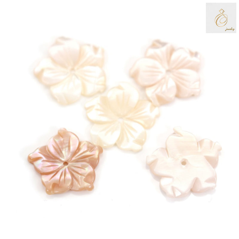 Pink mother-of-pearl shell flower charm, 15mm diameter, showing natural iridescent surface and delicate petal details for jewelry making