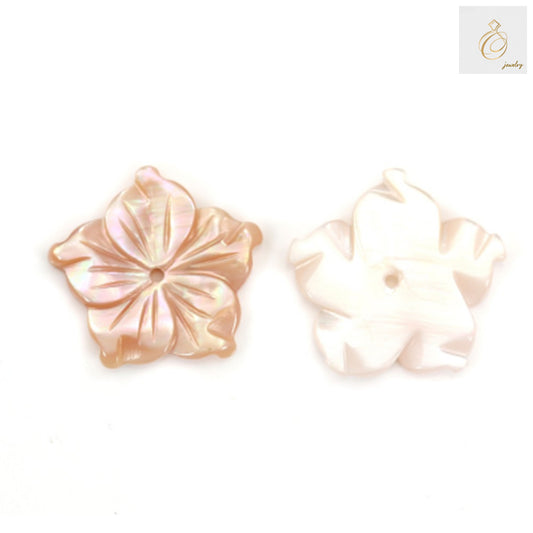 Close-up view of pink mother-of-pearl shell flower charm displaying lustrous finish and crafted flower shape, ideal for DIY jewelry projects
