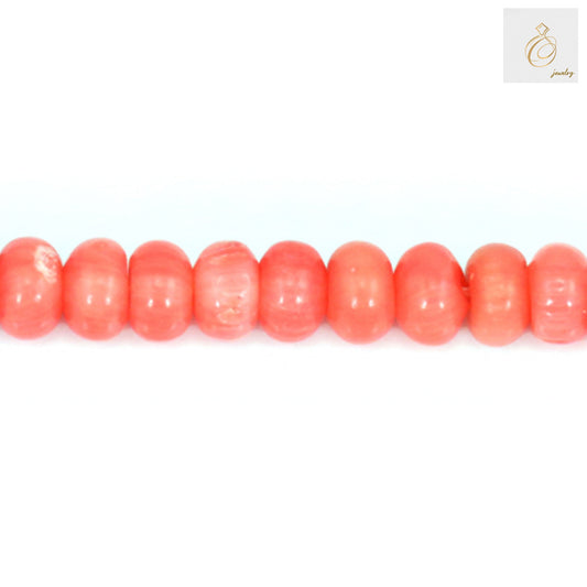 Close-up view of pink sea bamboo abacus beads showing smooth texture"
"Pink sea bamboo beads 4x6mm size comparison with ruler