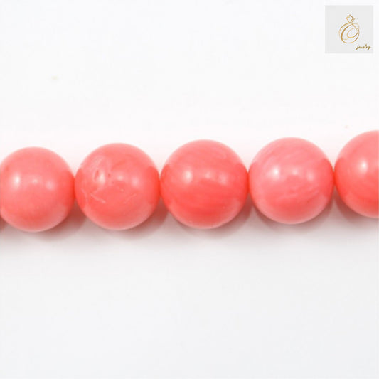 Pink sea bamboo round beads 10mm diameter on 40cm strand for jewelry making"
"Natural pink bamboo coral beads, round shape, 10mm size, full strand display