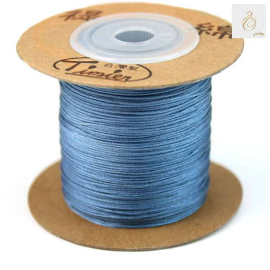 Blue polyester jewelry thread spool, 0.5mm diameter, 180 meters length"
"Premium blue craft thread for jewelry making and beading projects"
"High-quality polyester thread in vibrant blue color for DIY jewelry