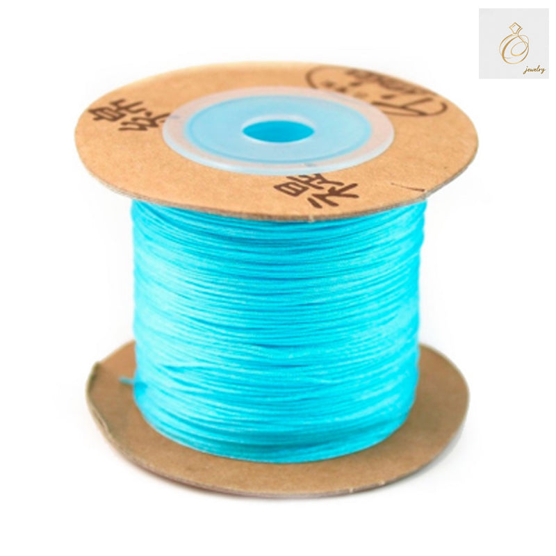 Premium blue polyester jewelry thread 0.5mm diameter on spool"
"High-quality blue craft thread for jewelry making and beading"
"Professional 0.5mm blue polyester thread 180m length for jewelry crafts