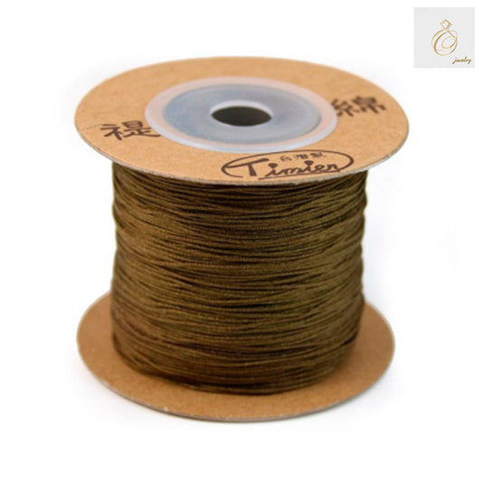 Brown polyester jewelry thread 0.5mm diameter on spool"
"Premium brown beading thread for jewelry making"
"180m brown polyester thread for crafting and beading