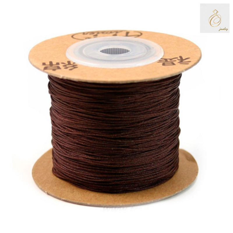Brown polyester jewelry thread spool 0.5mm diameter 180 meters"
"Premium brown beading thread for jewelry making crafts"
"Close-up of brown polyester thread texture for jewelry work"
"180m spool of 0.5mm brown jewelry making thread