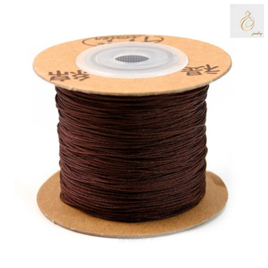 Brown polyester jewelry thread spool 0.5mm diameter 180 meters"
"Premium brown beading thread for jewelry making crafts"
"Close-up of brown polyester thread texture for jewelry work"
"180m spool of 0.5mm brown jewelry making thread