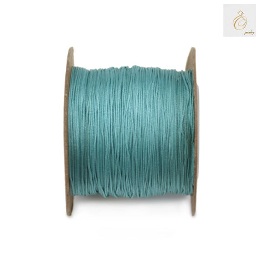 Green polyester jewelry thread 0.5mm diameter on spool"
"Premium green crafting thread for jewelry making and beadwork"
"180m green polyester thread spool for DIY jewelry projects