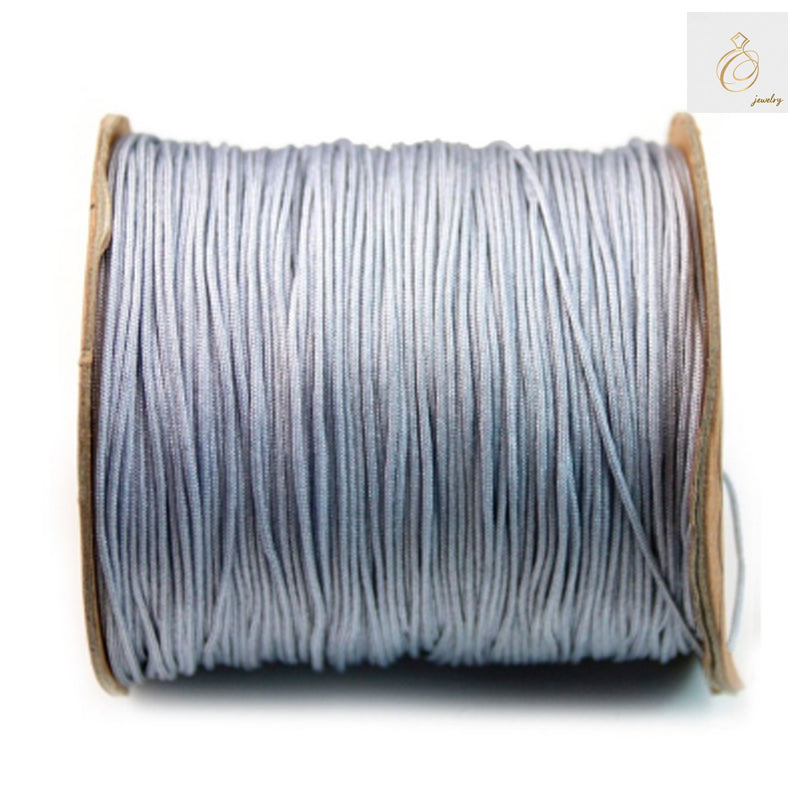 Grey polyester thread spool 1mm diameter 250 meters"
"Premium grey polyester sewing thread on spool"
"1mm grey polyester thread for sewing and crafting