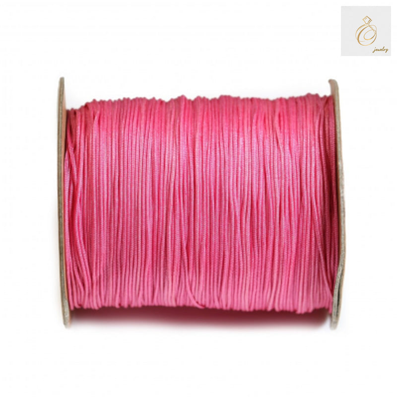 Pink polyester thread spool 1mm thickness 250 meters for sewing and crafting"
"High-quality pink polyester thread on white spool, 1mm diameter, 250m length"
"Vibrant pink sewing thread spool, polyester material, ideal for crafting projects