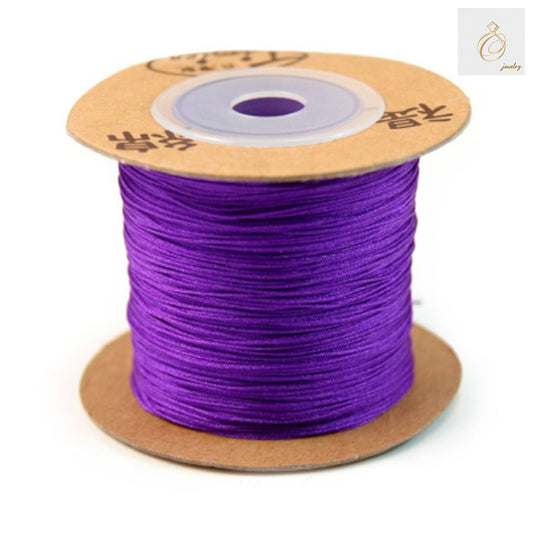 Purple polyester jewelry thread spool 0.5mm diameter 180 meters length"
"Premium purple craft thread for jewelry making and beading projects"
"High-quality polyester thread in vibrant purple color for professional jewelry crafting