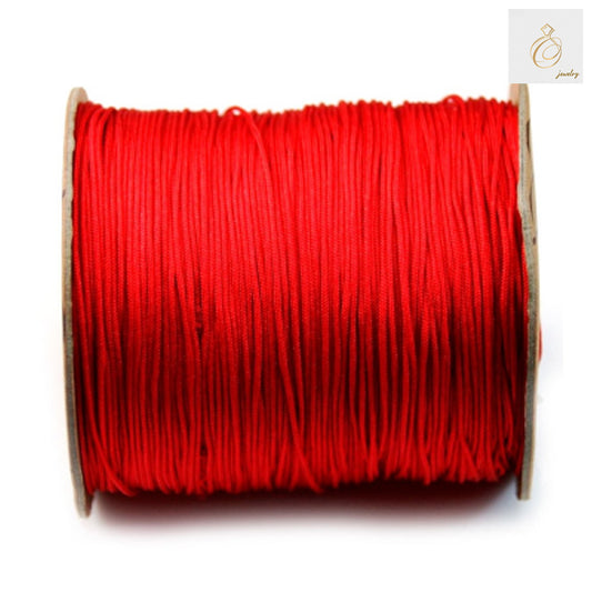 Red polyester jewelry thread 1mm diameter on spool for beading and crafting"
"Close-up of vibrant red craft string for jewelry making projects"
"Premium red polyester thread 250m length for beading supplies