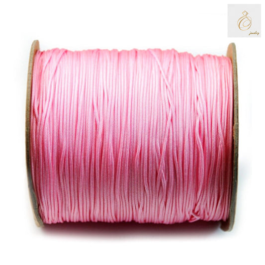 Rose pink polyester jewelry thread spool, 1mm diameter, 250 meters length for beading and crafts"
"Premium quality rose pink beading cord on spool, perfect for jewelry making projects"
"Close-up of rose pink polyester thread showing smooth texture and consistent 1mm thickness