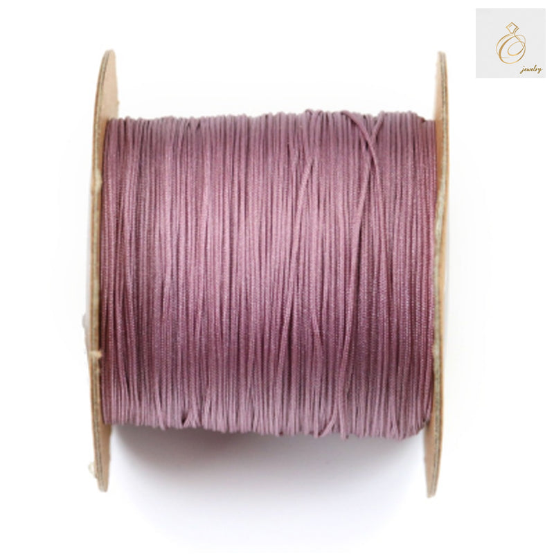 Premium violet polyester jewelry thread 0.5mm diameter on spool"