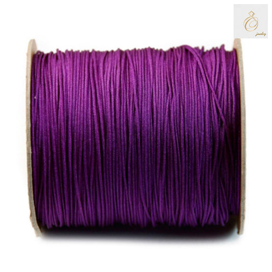 Purple polyester jewelry thread 1mm diameter on spool, 250 meters length for beading and crafts"
"Close-up of purple polyester beading thread showing texture and color quality"
"JewelryDan purple polyester thread spool for jewelry making and craft projects