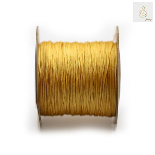 Premium yellow polyester jewelry thread spool 0.5mm diameter 180m length"
"Yellow polyester thread for jewelry making and beading crafts"
"High-quality yellow crafting thread on spool for jewelry projects