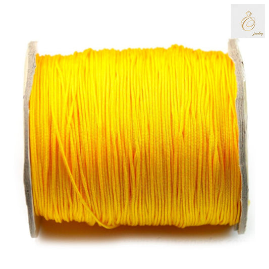 Yellow polyester jewelry thread 1mm diameter on 250m spool"
"Premium yellow beading string for jewelry making crafts"
"1mm yellow polyester thread spool for beading and crafts