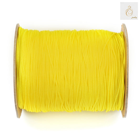 Yellow polyester jewelry thread 1mm diameter on spool, 250 meters length for beading and crafting"
"Bright yellow beading thread spool for jewelry making projects"
"1mm yellow polyester string for necklace and bracelet making