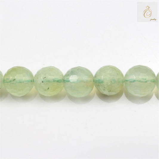Natural prehnite faceted round beads 12mm diameter on white background"