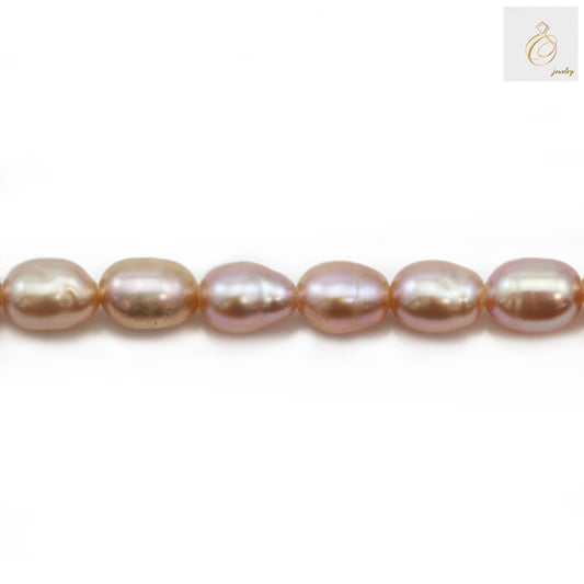 Close-up view of purple freshwater cultured pearls showing natural luster and oval shape"
"Individual purple pearl beads displaying 3-4mm size and consistent quality