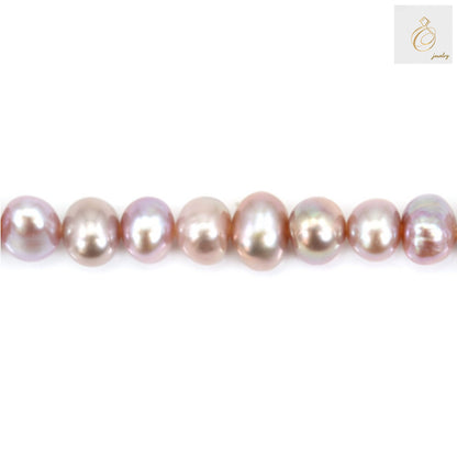 Close-up view of purple freshwater cultured pearls displaying natural luster and oval shape