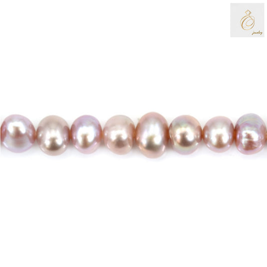 Close-up view of purple freshwater cultured pearls displaying natural luster and oval shape