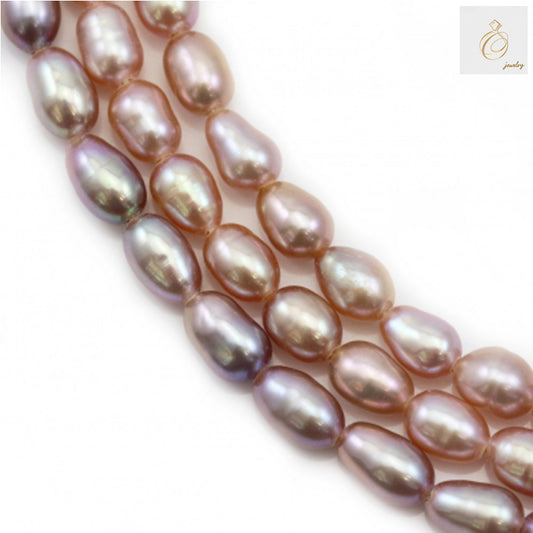 Purple freshwater cultured pearl strand with oval 3-4mm beads on white background"
"Lustrous purple oval pearls arranged in 39cm strand for jewelry making