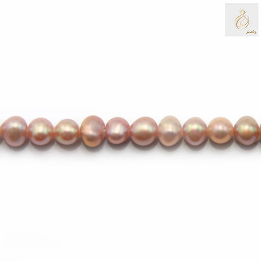 Purple freshwater cultured pearl strand, oval shaped 4-5mm pearls, 39-40cm length"
"Lustrous purple oval freshwater pearls arranged in a strand for jewelry making