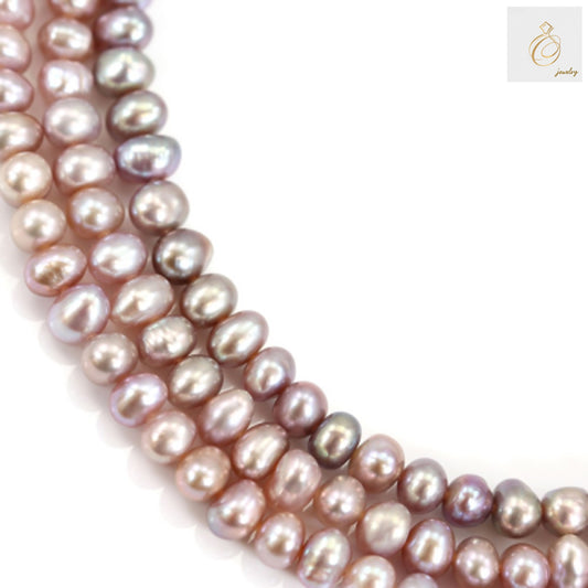 Purple freshwater cultured pearl strand showing oval 6-6.5mm pearls in 39-40cm length