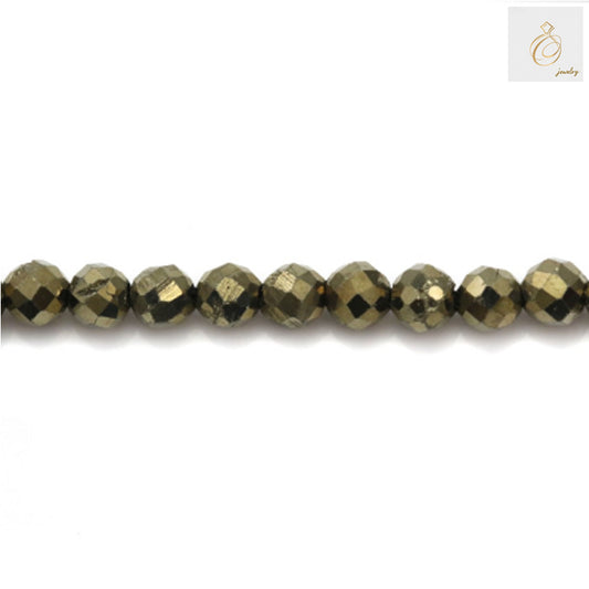 Close-up view of pyrite gemstone beads strand, displaying natural golden color and faceted surface detail