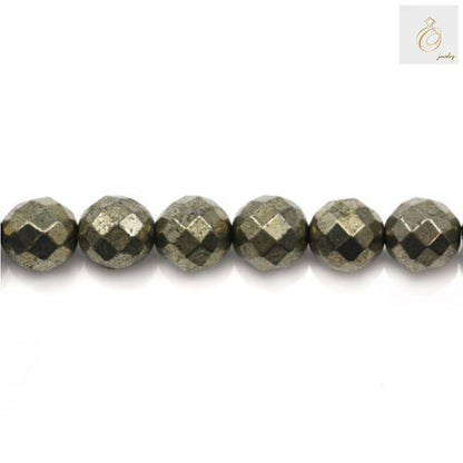 Close-up view of faceted pyrite beads showing golden metallic surface and round shape, 10mm diameter with 1mm holes