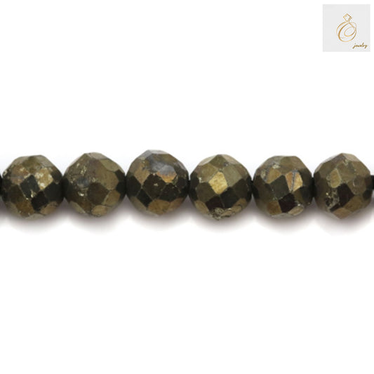 Close-up view of 4mm pyrite gemstone beads displaying natural metallic shine and round faceted shape