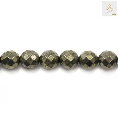 Close-up view of 6mm pyrite gemstone beads displaying brilliant golden color and faceted surface