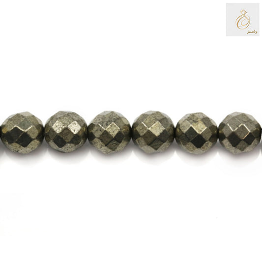 Close-up view of 6mm pyrite gemstone beads displaying brilliant golden color and faceted surface