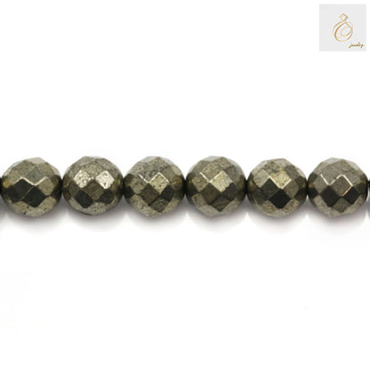 Close-up view of 8mm pyrite beads showing faceted cut and brilliant golden shine, jewelry making supplies