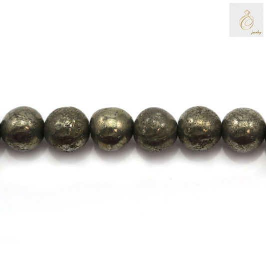 Close-up view of 4mm pyrite beads showing natural golden metallic luster and round shape, perfect for DIY jewelry projects