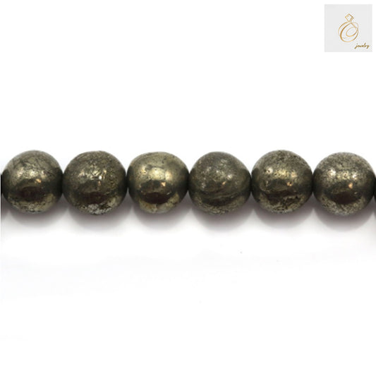 Close-up view of pyrite beads displaying the natural golden metallic shine and consistent 6mm round shape, ideal for crafting bracelets and necklaces