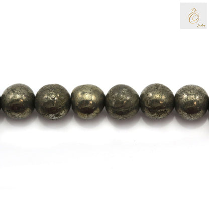 Close-up view of pyrite beads displaying the natural golden luster and metallic finish of each 8mm round bead