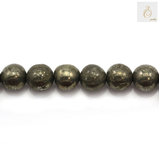Close-up view of pyrite beads displaying the natural golden luster and metallic finish of each 8mm round bead