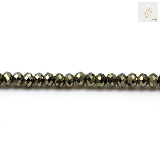 Close-up of pyrite faceted abacus beads showing brilliant metallic luster and precise cut